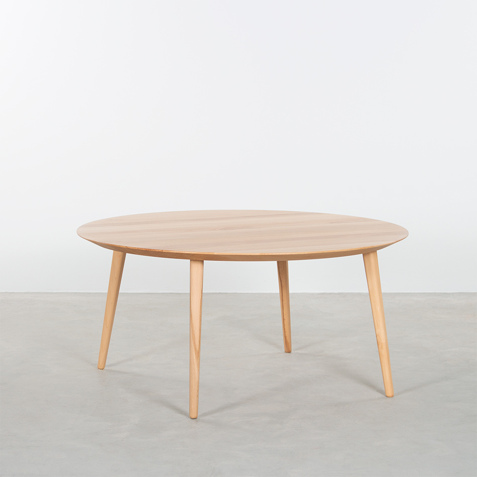 Rounded coffee table with straight legs