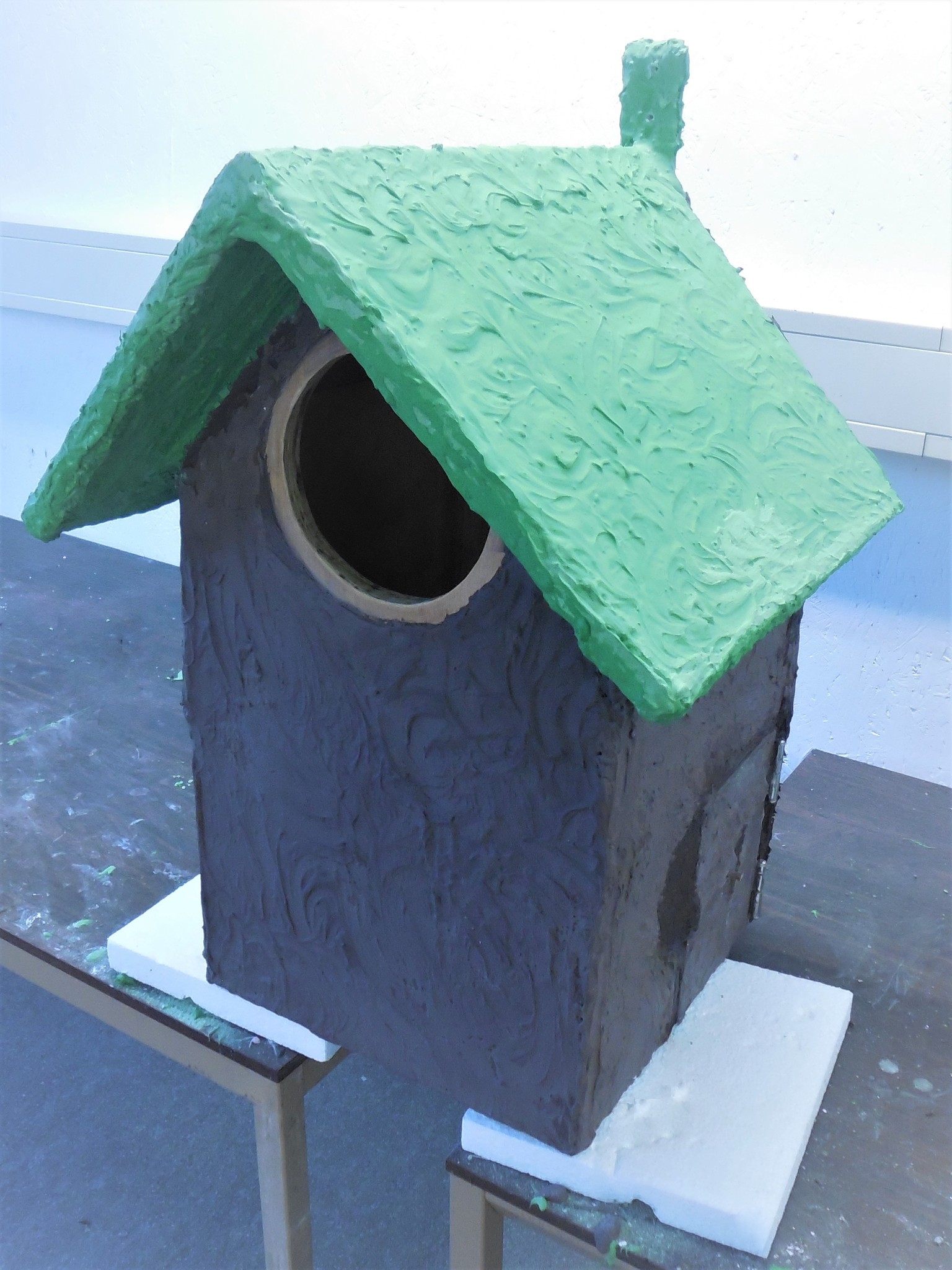 Birdhouse coated with acrylic resin