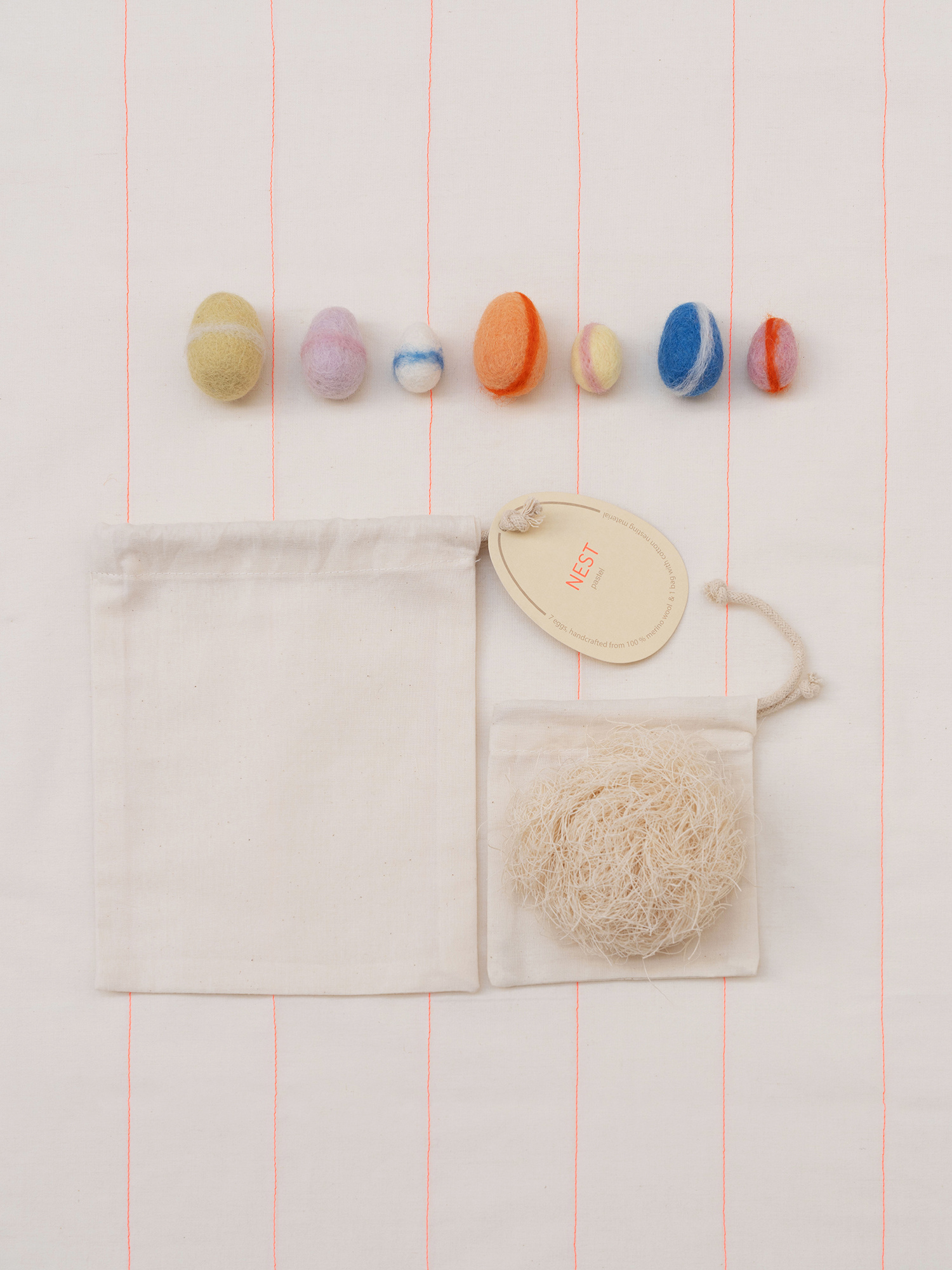 NEST wool eggs pastel | 7 handgemaakte wollen eitjes met nestmateriaal
