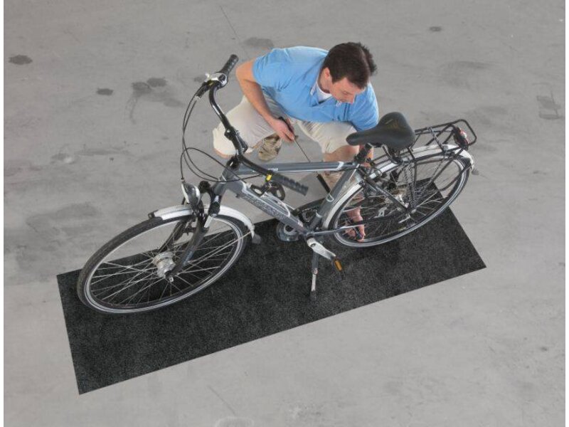 Mat onderhoud fiets beschermt uw vloer