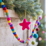 Sjaal met Verhaal Filz Weihnachtshänger Ster Kitschmas fuchsia