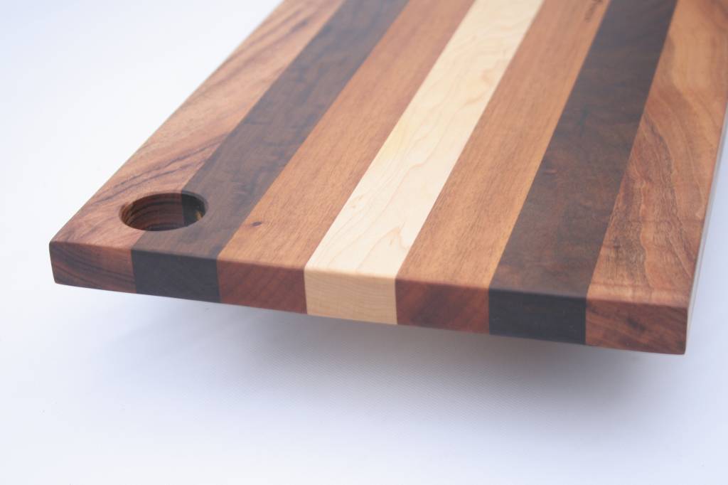 Bread board made of the Brazilian hardwoods, tigerwood, greenheart, curupay  a;ongside Dutch maple. A suitable size of 23x50 cm. - Kitchen artwoods