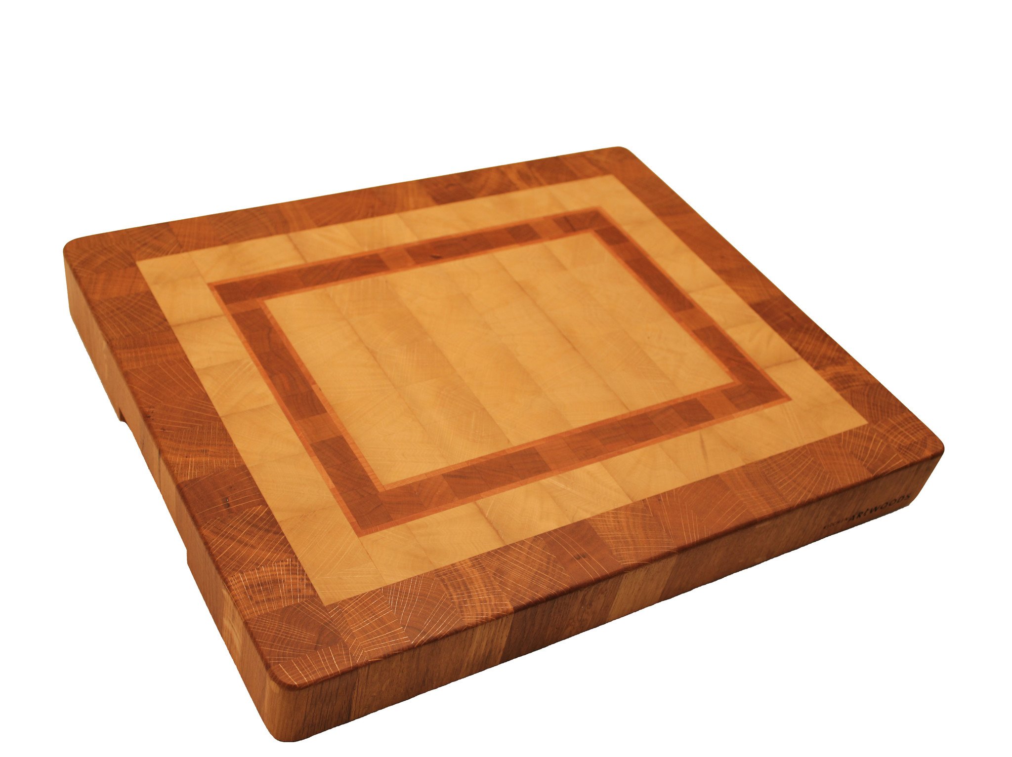 end grain cuttingboard made of hornbeam with a galloon of cherry and beech and a rim of oak