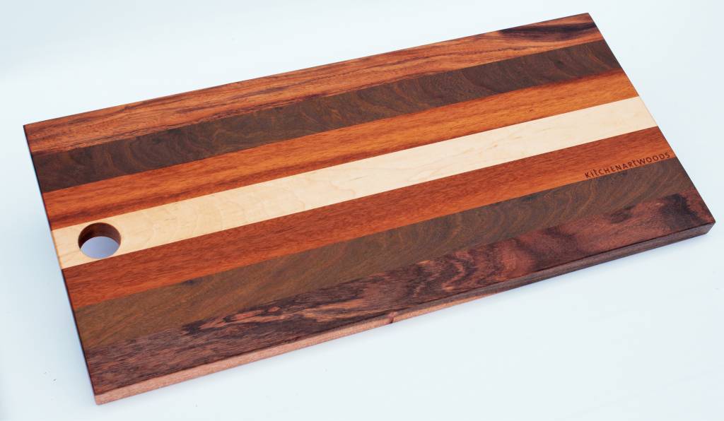 Bread board made of the Brazilian hardwoods, tigerwood, greenheart, curupay a;ongside Dutch maple. A suitable size of 23x50 cm.