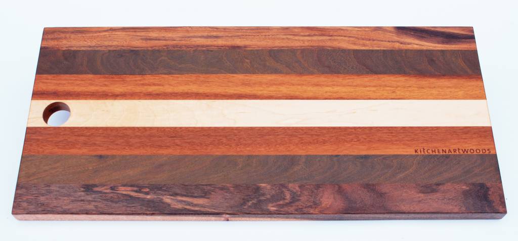 Bread board made of the Brazilian hardwoods, tigerwood, greenheart, curupay a;ongside Dutch maple. A suitable size of 23x50 cm.