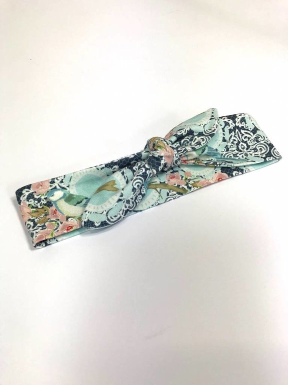 Blauwe haarband strik met vogel/bloem print