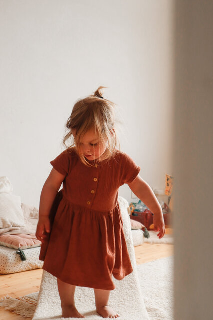 Child standing on a Wobbel balance board