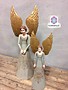 Wooden angel with gold wings