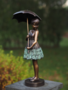 Statue girl with umbrella