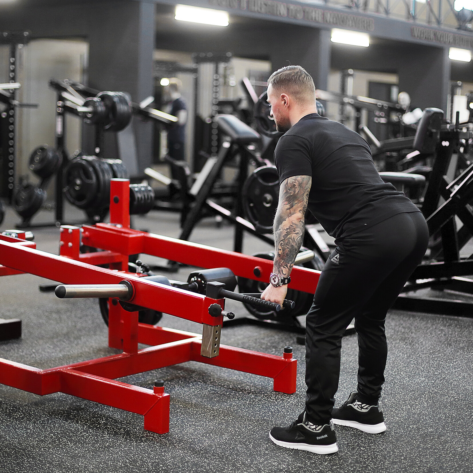 Trapezmuskelmaschine / Shrug Machine (1G), stehend / Plate loaded