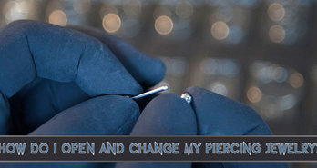 How do I open and change my piercing jewelry?