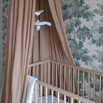 Canopies and mosquito nets for a cozy look in the room