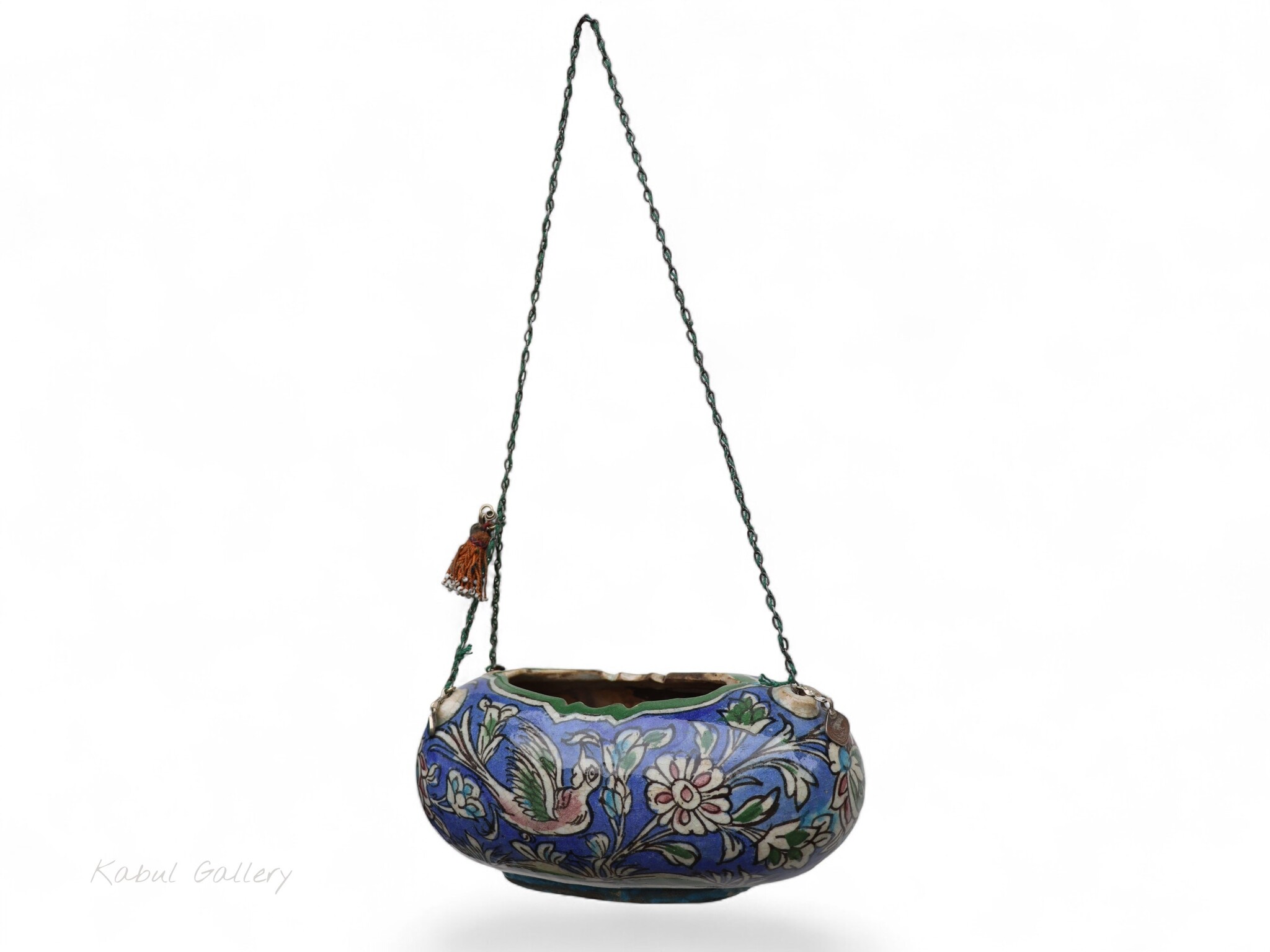 islamic Qajar Kashkul, 20th Century, made from ceramic, stone paste with polychrome flower decoration  underneath a clear glaze.   25A