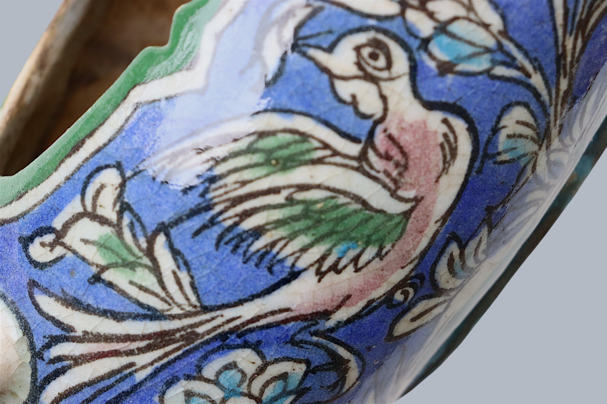 islamic Qajar Kashkul, 20th Century, made from ceramic, stone paste with polychrome flower decoration  underneath a clear glaze.   25A