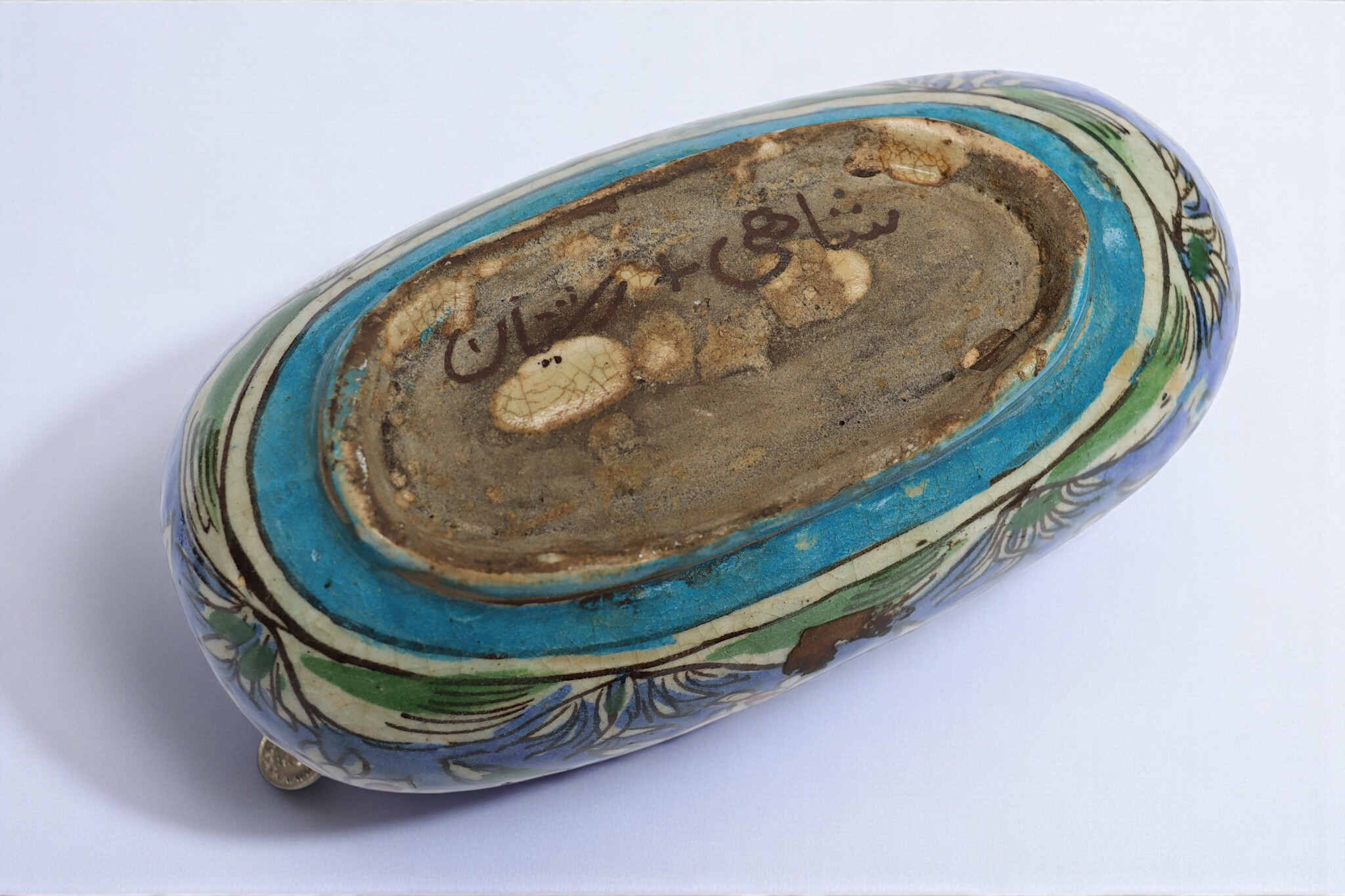 islamic Qajar Kashkul, 20th Century, made from ceramic, stone paste with polychrome flower decoration  underneath a clear glaze.   25A