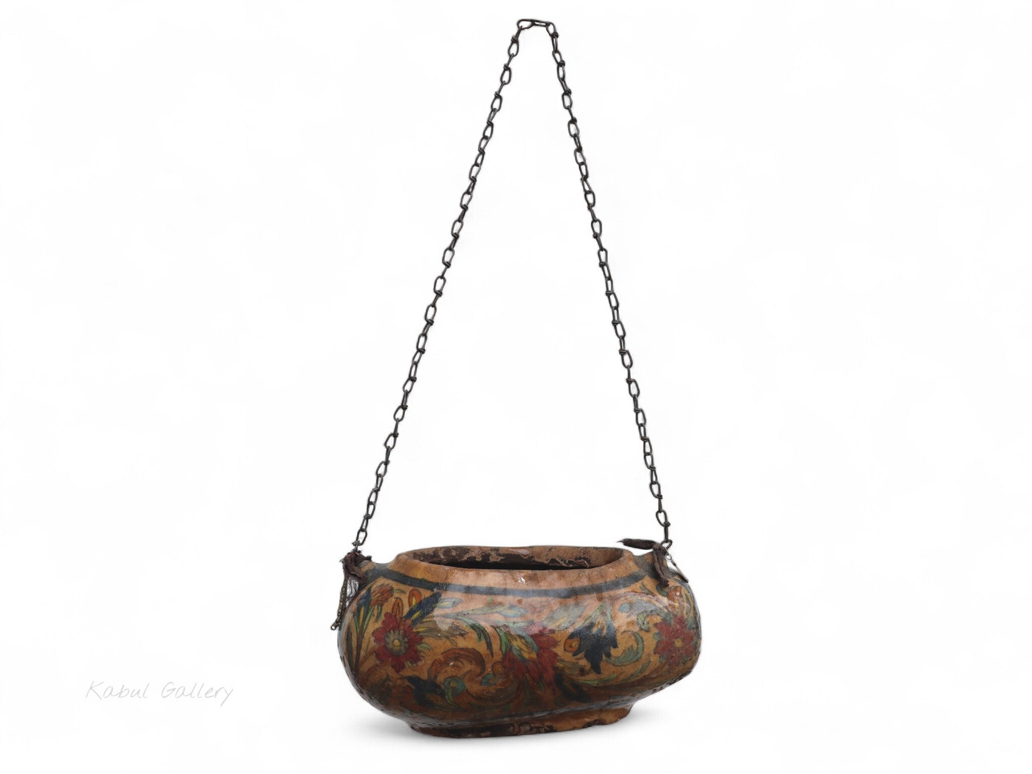 islamic Qajar Kashkul, 20th Century, made from ceramic, stone paste with polychrome flower decoration  underneath a clear glaze.   25B