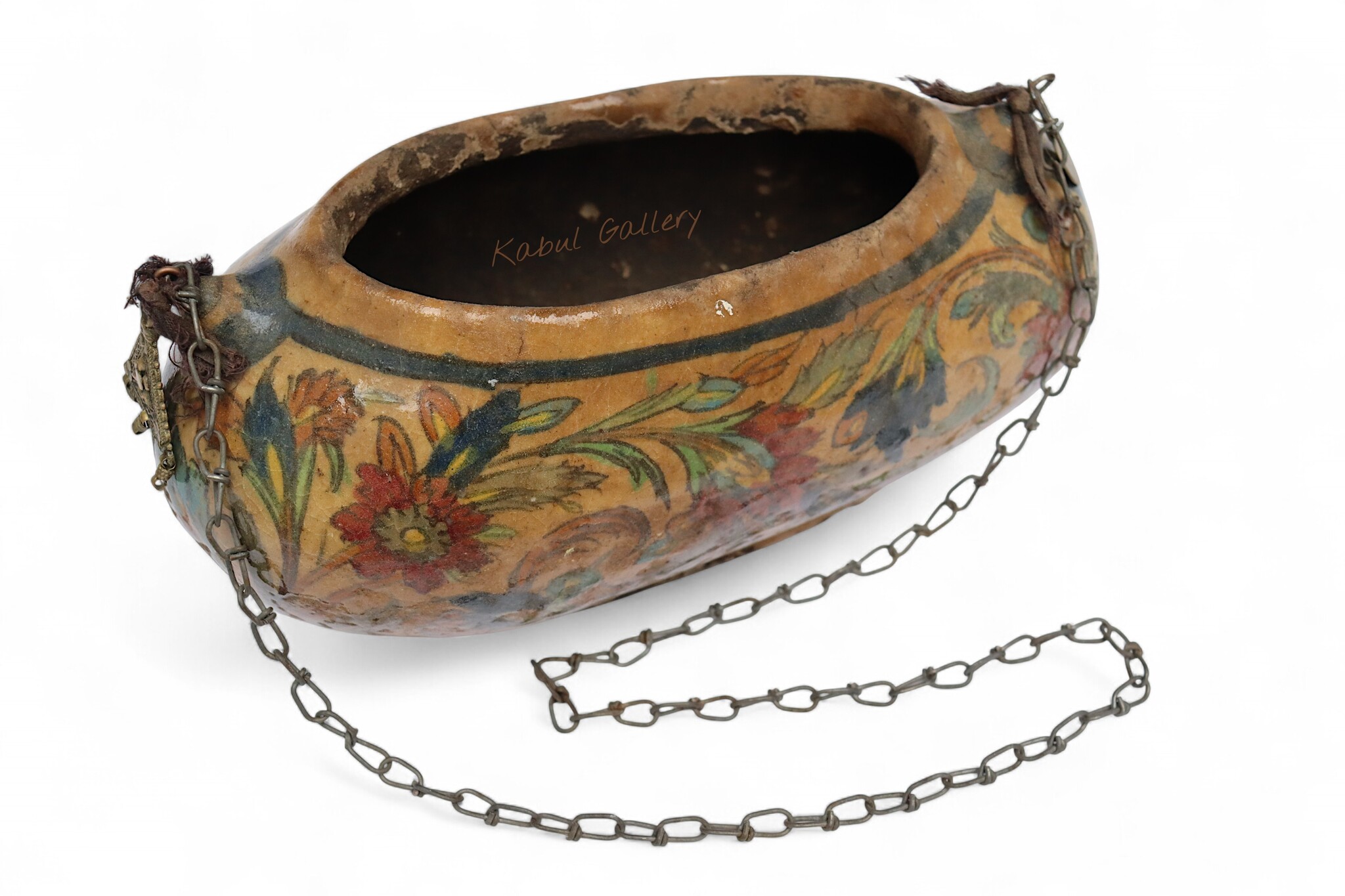 islamic Qajar Kashkul, 20th Century, made from ceramic, stone paste with polychrome flower decoration  underneath a clear glaze.   25B