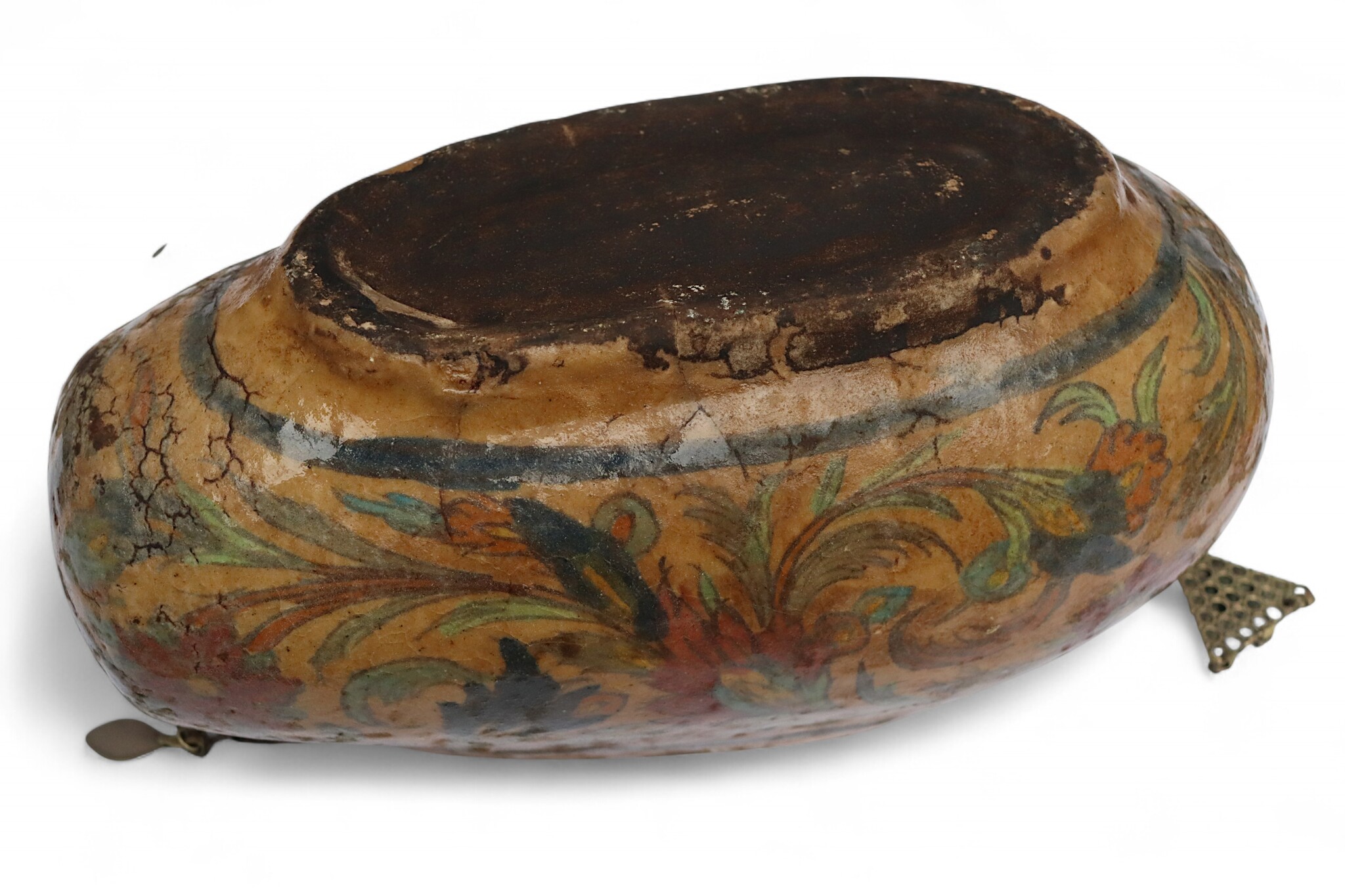 islamic Qajar Kashkul, 20th Century, made from ceramic, stone paste with polychrome flower decoration  underneath a clear glaze.   25B