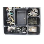 Box filled with divers spinning reel parts
