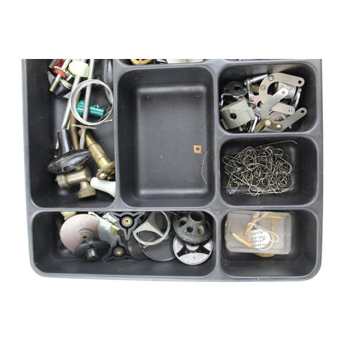 Box filled with divers spinning reel parts