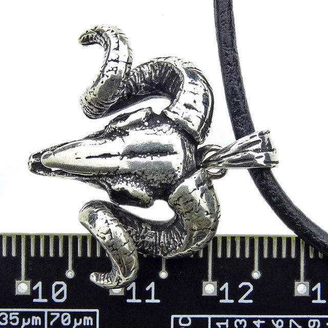 Beautiful silver pendant of a ram skull Beautiful silver pendant of a ram skull