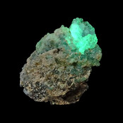 Hyalite opal with green fluorescence under a short-wave UV light Hyalite opal with green fluorescence under a short-wave UV light