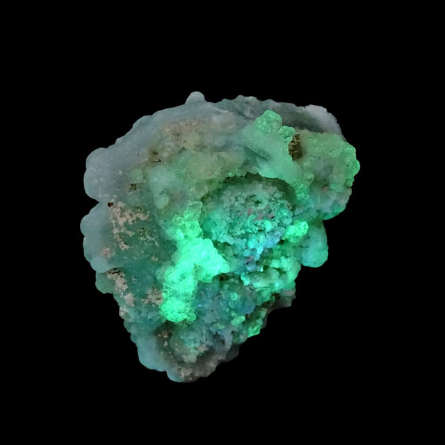 Hyalite opal with green fluorescence under a short-wave UV light Hyalite opal with green fluorescence under a short-wave UV light