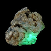 Hyalite opal with green fluorescence under a short-wave UV light Hyalite opal with green fluorescence under a short-wave UV light