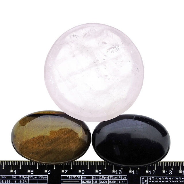 Bowl from rose quartz with handstones of tigereye and obsidian Bowl from rose quartz with handstones of tigereye and obsidian