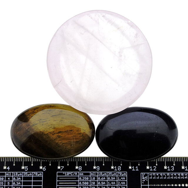 Bowl from rose quartz with handstones of tigereye and obsidian Bowl from rose quartz with handstones of tigereye and obsidian