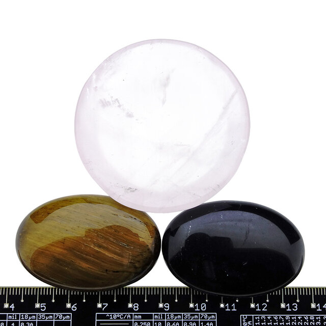 Bowl from rose quartz with handstones of tigereye and obsidian Bowl from rose quartz with handstones of tigereye and obsidian