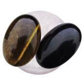 Bowl from rose quartz with handstones of tigereye and obsidian Bowl from rose quartz with handstones of tigereye and obsidian