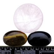 Bowl from rose quartz with handstones of tigereye and obsidian Bowl from rose quartz with handstones of tigereye and obsidian