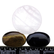 Bowl from rose quartz with handstones of tigereye and obsidian Bowl from rose quartz with handstones of tigereye and obsidian