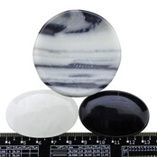 Bowl from zebra jasper with handstones of rock crystal and obsidian