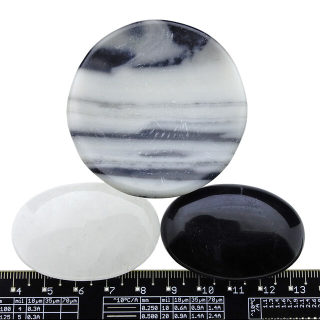 Bowl from zebra jasper with handstones of rock crystal and obsidian