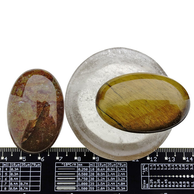 Bowl from smokey quartz with handstones of tigereye and jasper Bowl from smokey quartz with handstones of tigereye and jasper
