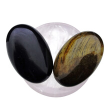 Bowl from rose quartz with handstones of tigereye and obsidian