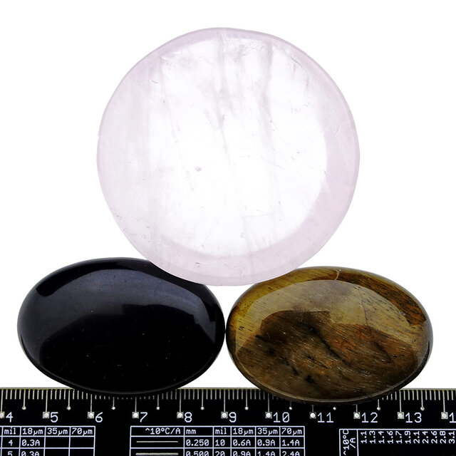 Bowl from rose quartz with handstones of tigereye and obsidian Bowl from rose quartz with handstones of tigereye and obsidian