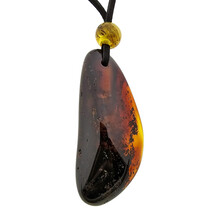 Beautiful pierced Baltic amber pendant with cord