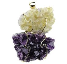 Pendant of rough heated and natural amethyst. The pendant is goldplated
