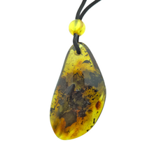 Beautiful pierced Baltic amber pendant with cord
