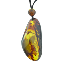 Beautiful pierced Baltic amber pendant with cord
