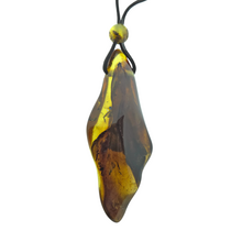 Beautiful pierced Baltic amber pendant with cord
