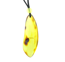 Beautiful pierced Baltic amber pendant with cord