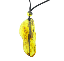 Beautiful pierced Baltic amber pendant with cord