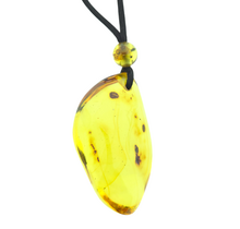 Beautiful pierced Baltic amber pendant with cord