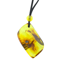 Beautiful pierced Baltic amber pendant with cord