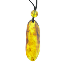 Beautiful pierced Baltic amber pendant with cord