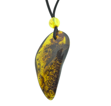 Beautiful pierced Baltic amber pendant with cord